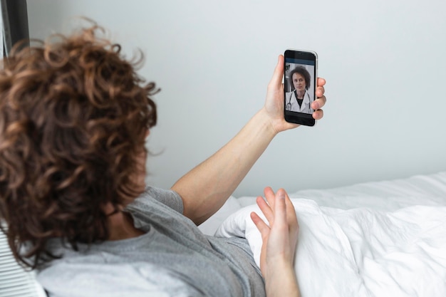 Man having a video call with a doctor