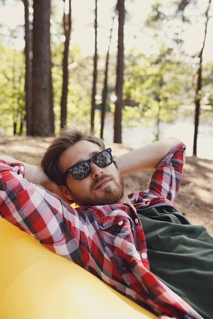 Free photo man hiking in forest