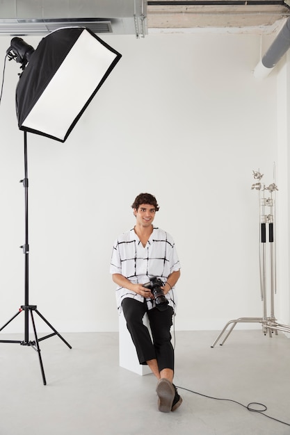 Free photo man in his professional photography studio