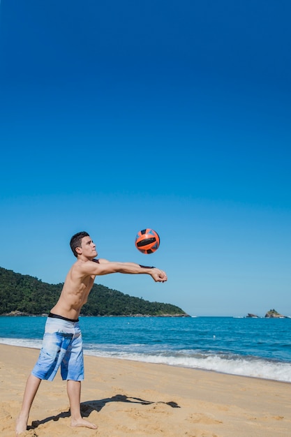 Man hitting volleyball