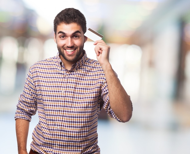 Man holding card in hand. 