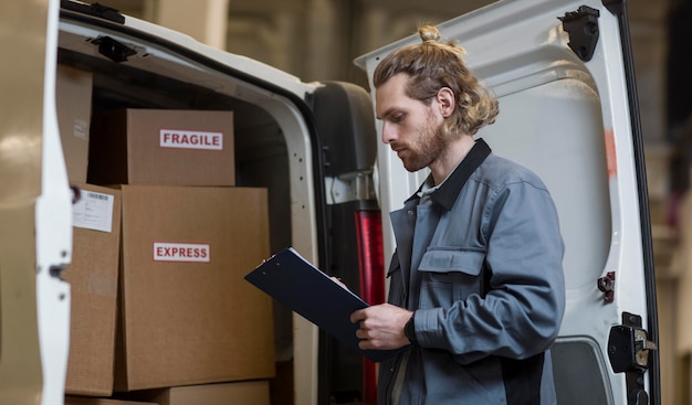 Free Photo man holding clipboard medium shot