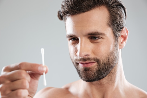 Man holding ear stick isolated