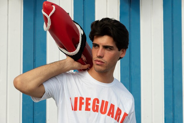 Man holding lifesaving buoy medium shot