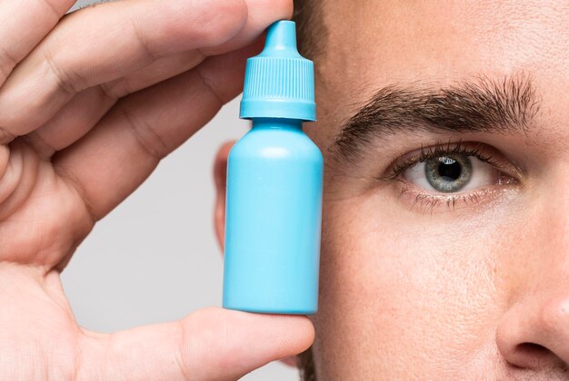 Man holding a medicinal bottle