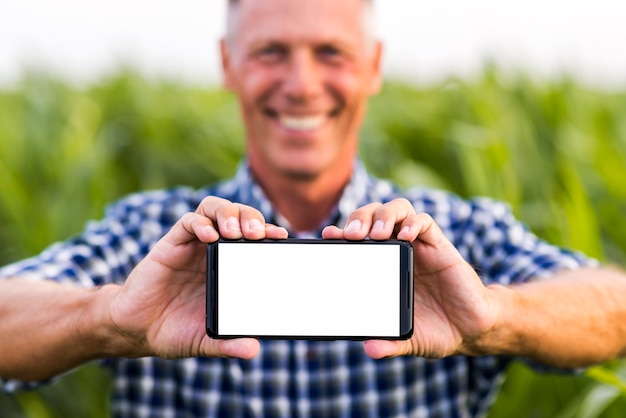 Man holding phone with both hands mock-up