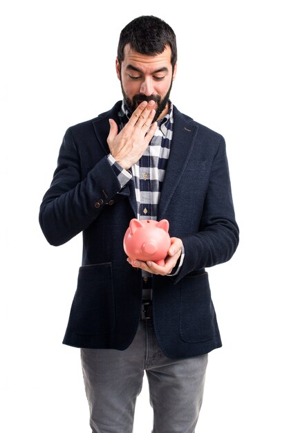 Man holding a piggybank