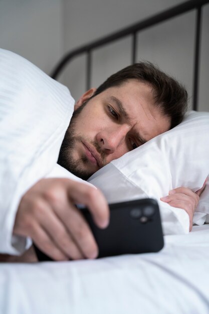 Man holding smartphone medium shot