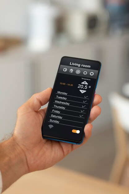 Man holding a smartphone with a home automation app