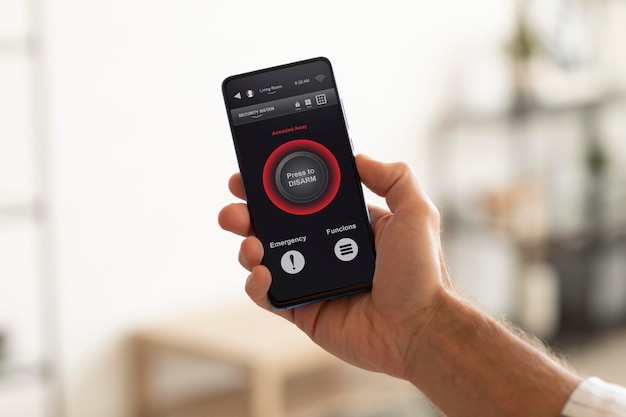 Man holding a smartphone with a home automation app