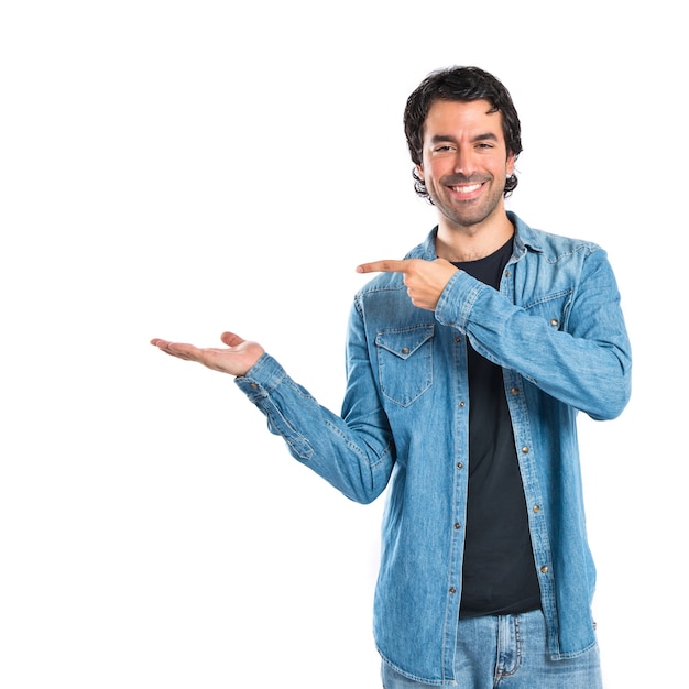 Man holding something over white background