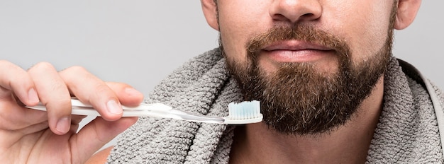 Man holding a toothbrush close-up