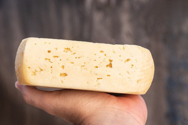 Man holding traditional Brazilian cheese