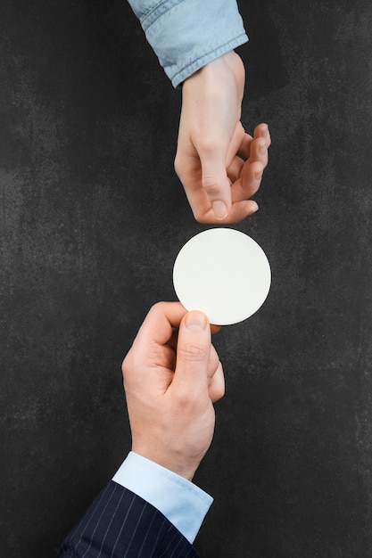 Free Photo man holding a white empty card