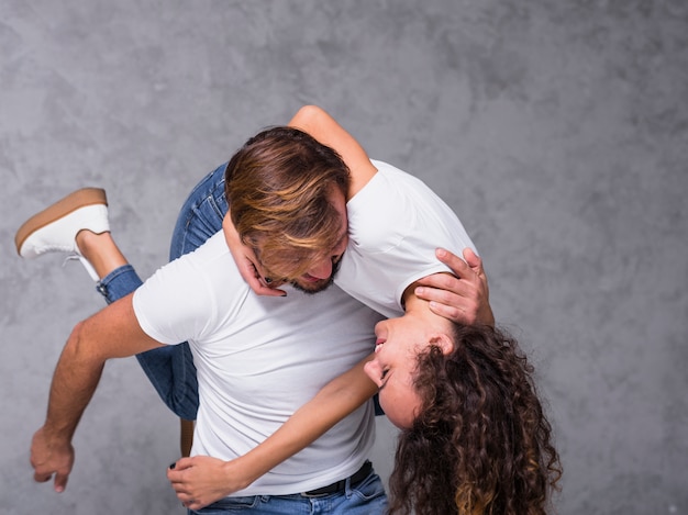 Man holding woman on shoulder 