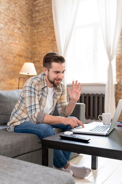 Man at home having videocall with family