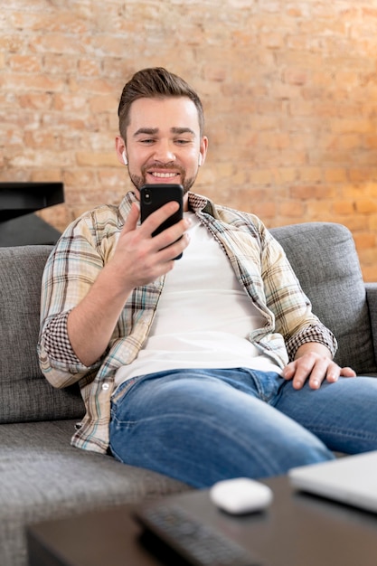 Man at home having videocall with family