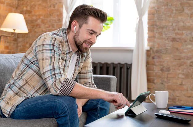 Man at home having videocall with family