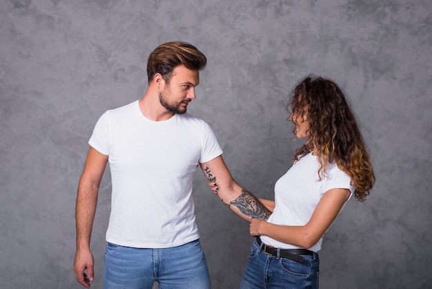 Man hugging woman with hand 