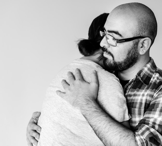 Free photo man hugging woman