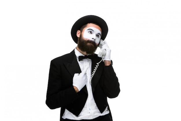 Free Photo man in the image mime holding a handset.