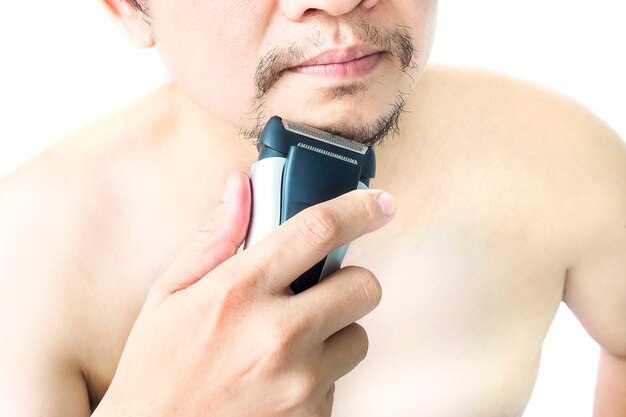 Man is using shaver isolated over white background