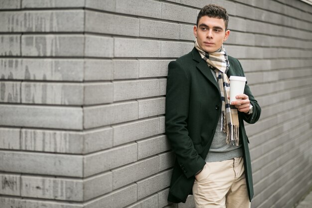 Man in jacket with coffee