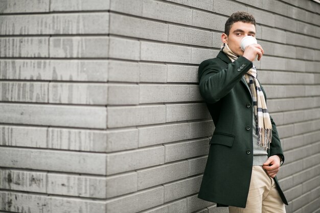 Man in jacket with coffee