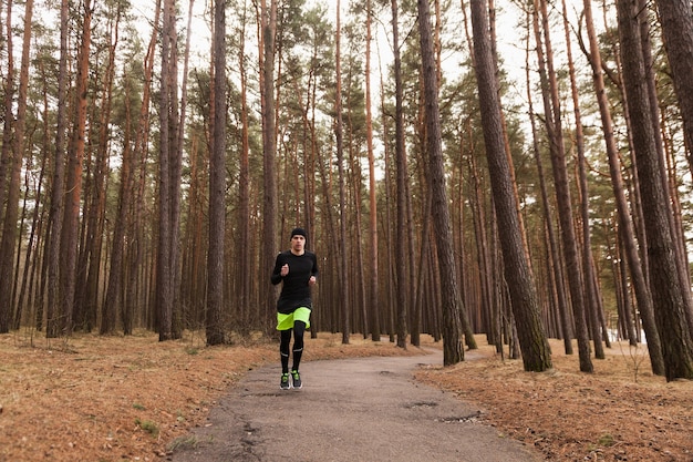 Man jogging in woods