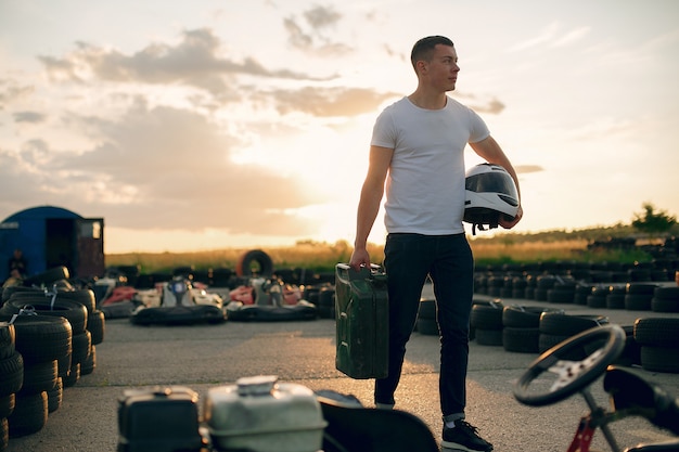 Free Photo man in a karting circuit with a car