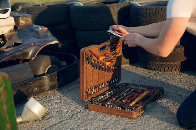 Man in a karting circuit with a car