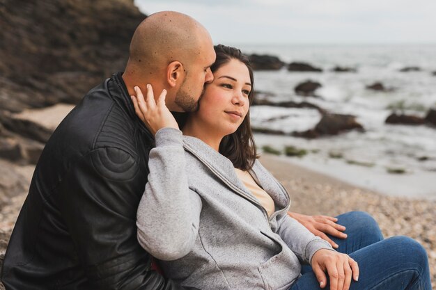 Man kissing his girlfriend