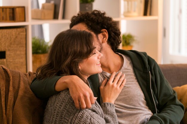 Man kissing his wife on the cheek