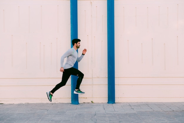 Man leaping near wall