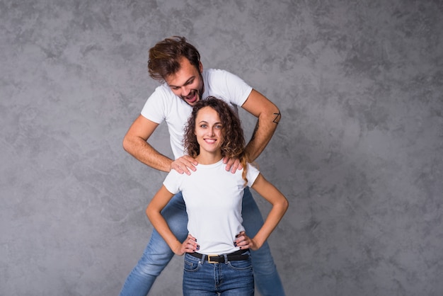 Man lifting up on woman shoulders 