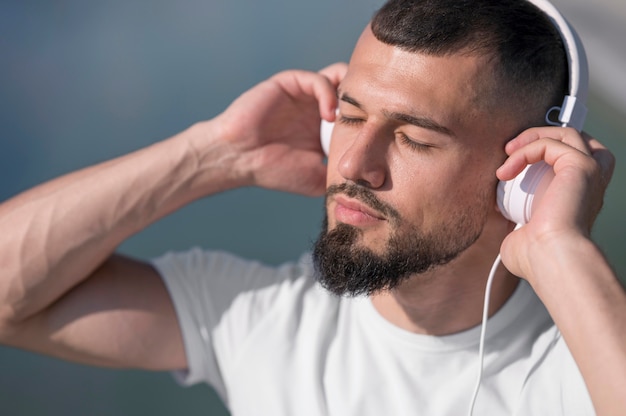 Man listening music with his eyes closed