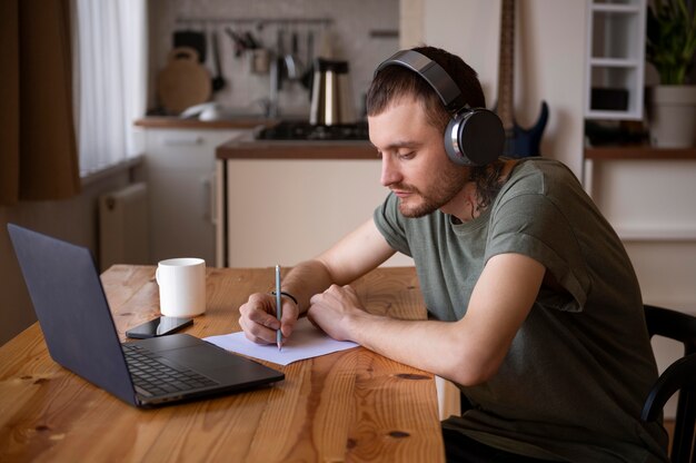 Man listening some music on headphone in his free time