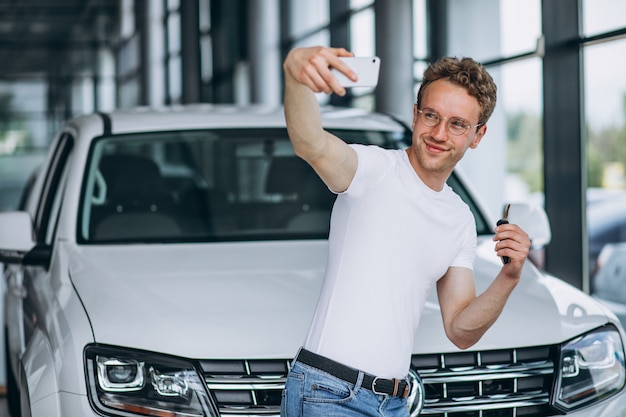 Man looking for a car in a car showroom