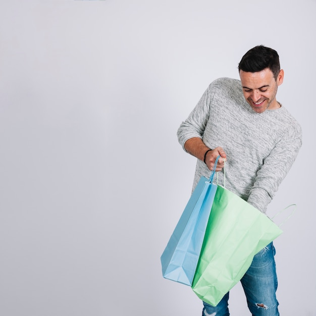 Man looking in shopping bag