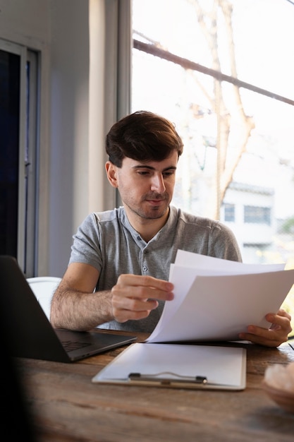 Man looking through notes