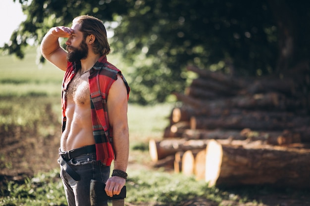 Man lumberjack in forest