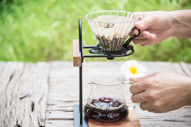 Free Photo man making drip fresh coffee in vintage coffee shop