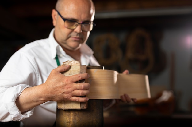 Man making instruments in his workshop