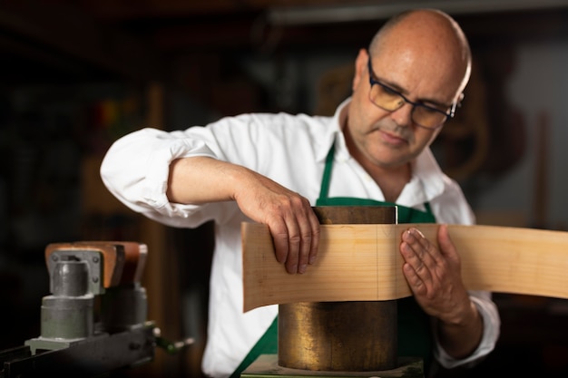 Man making instruments in his workshop