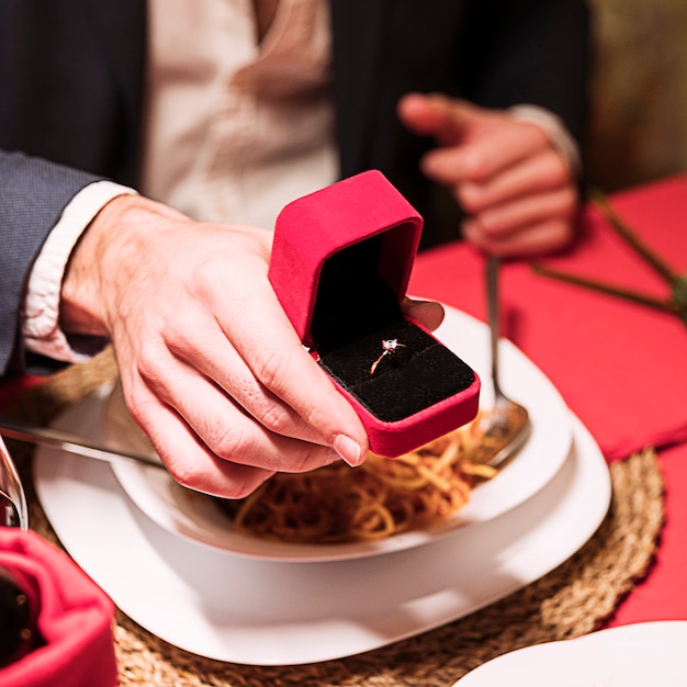 Free photo man making proposal at festive table