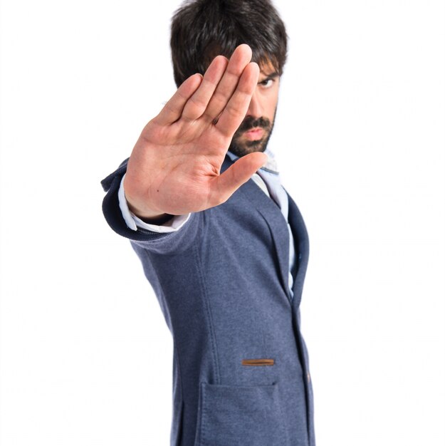 man making stop sign over white background