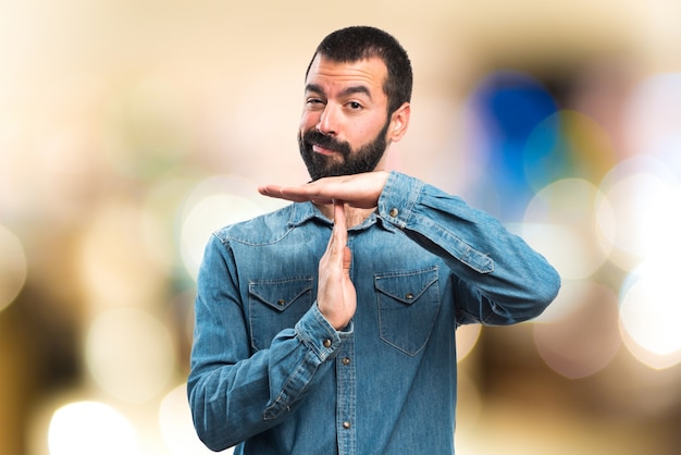 Man making time out gesture