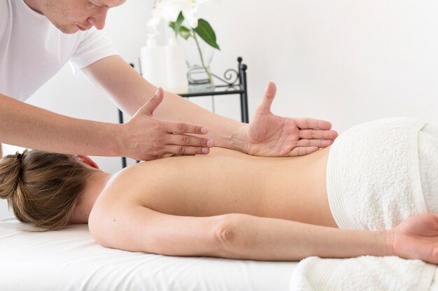 Man massaging woman's back