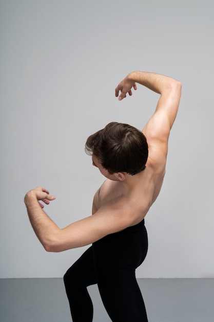 Man moving his body in studio medium shot