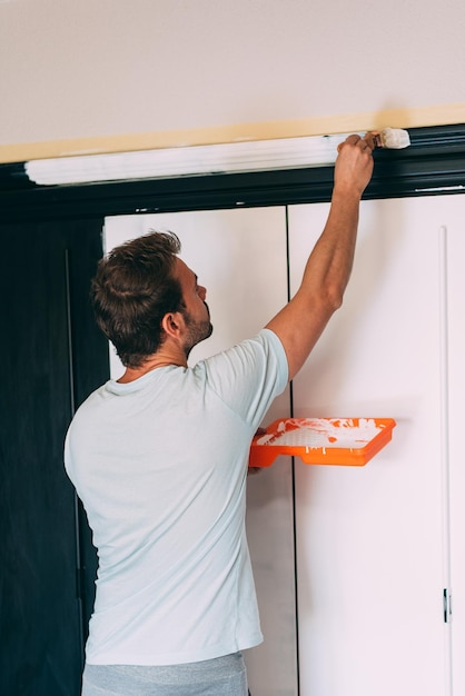 Man painting a wardrobe